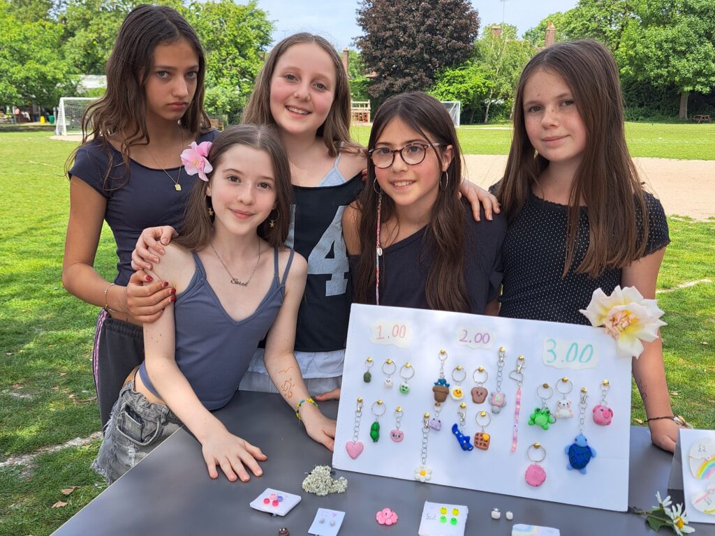 Female Year 7 students pose with their self-made jewellery store