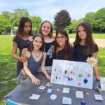 Female Year 7 students pose with their self-made jewellery store