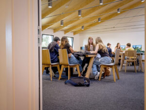 Students at a desk in the study area of the Sixth Form Centre