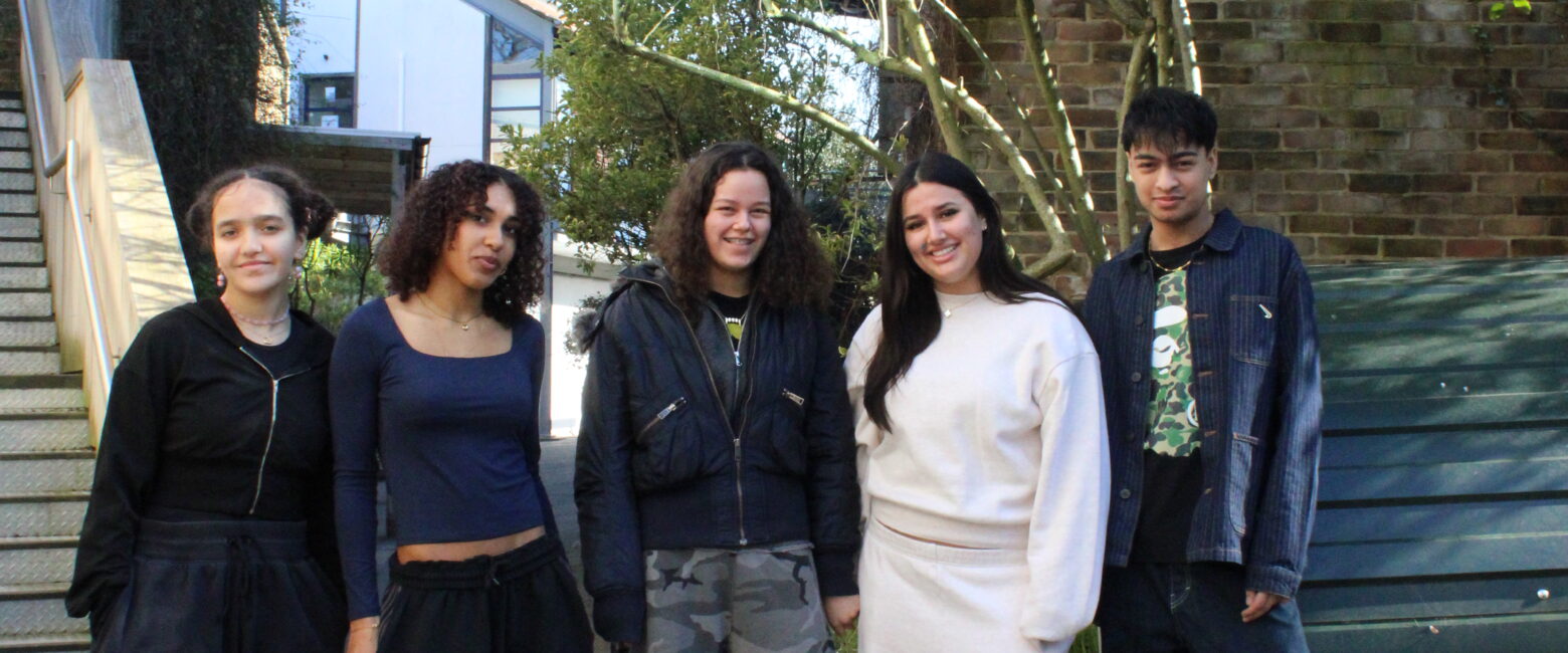 A group of five students both male and female stand outside at The King Alfred School
