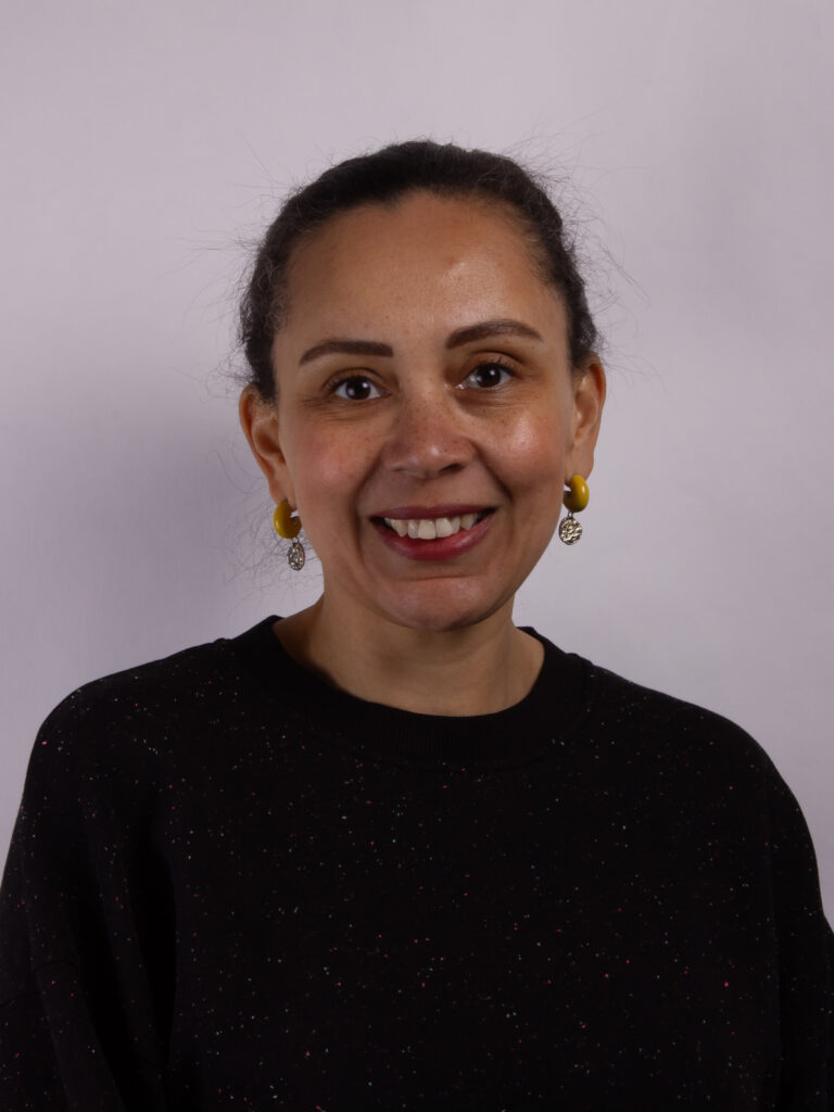 Headshot of a woman wearing a dark sweater
