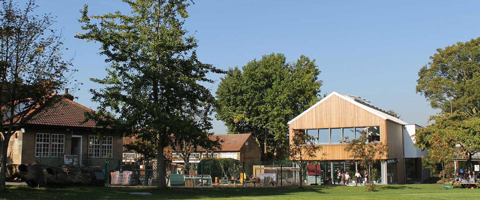 Buildings seen across the school field at The King Alfred School