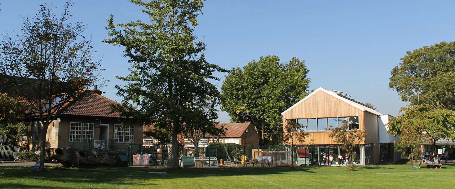 The Lower School building of The King Alfred School North London seen from across the field